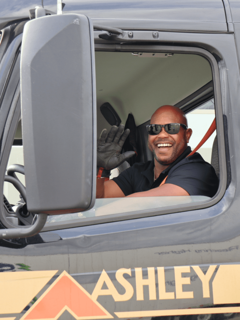 Ashley Driver with Truck Smiling