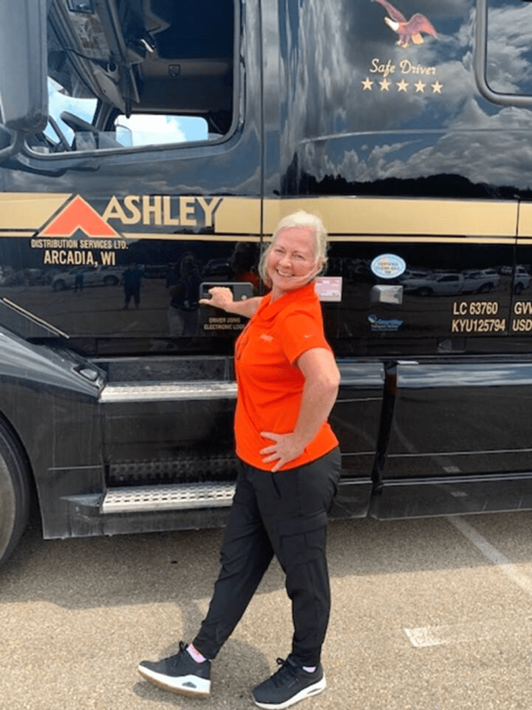 Ashley Driver with Truck Smiling